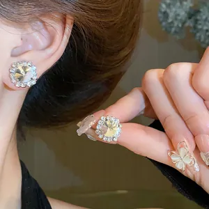 Detailed macro shot showing the sparkle of these square crystal stud earrings for women