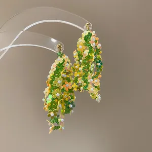 Long beaded tassel earrings with colorful flower sequins in green and yellow