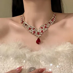 Close-up of retro palace style necklace with red water drop pendant on model neck