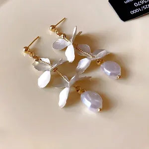 Elegant long petal earrings with irregular pearls in a French vintage style design.