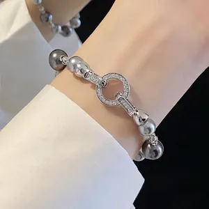 Bracciale retrò francese con perle grigie e chiusura circolare in zircone scintillante
