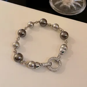 Elegante bracciale con zirconi e perle grigie, design francese vintage da donna