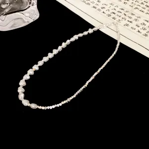 Detailed view of the unique crushed silver and pearl bead spliced necklace design