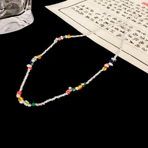 Detailed view of silver-plated irregular beads and colorful spliced neck jewelry.