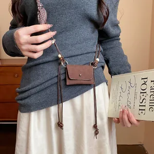Cintura a catena in tessuto marrone stile etnico con perle in legno e fiocco