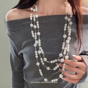 Elegant French vintage multi-layer pearl necklace with silver accents for women.