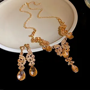 Elegant vintage court style necklace and earring set with amber teardrop crystal rhinestones