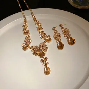 Luxurious vintage gold rhinestone water drop necklace and earring set jewelry