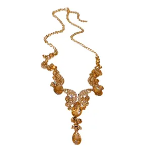 Vintage palace style gold necklace with champagne teardrop crystals and rhinestones.