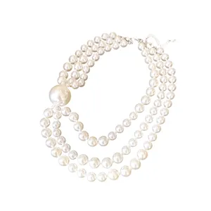 Elegant French vintage multi-strand white pearl necklace with a large focal pearl