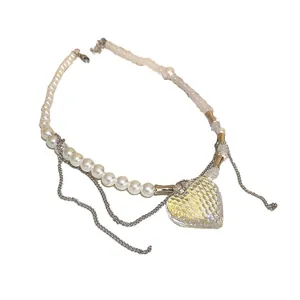 Double-layer baroque pearl necklace with a honeycomb textured heart pendant charm