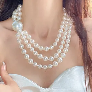 Detailed view of an elegant French retro multi-strand pearl necklace for women's style