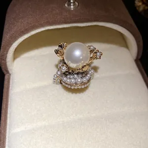 Elegant French vintage pearl flower ring displayed in a premium luxury jewelry box.
