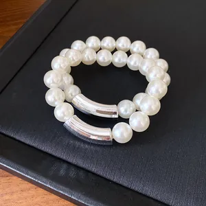 Close-up of elegant French vintage pearl necklace with silver metal accents