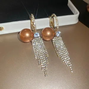 Elegant French vintage drop earrings with champagne pearls and long crystal tassels