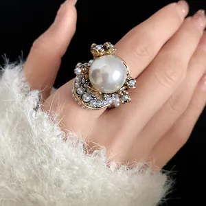 Exquisite French vintage oversized pearl flower ring worn on a finger as fashion jewelry