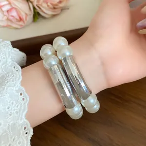 Close-up detail of an elegant French vintage double-layer pearl bracelet worn on a wrist
