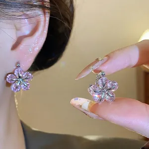 Sparkling pink zirconia flower hoop earrings with an elegant minimalist design for women