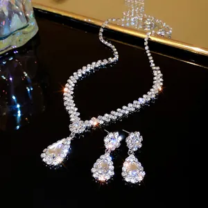 Sparkling rhinestone bridal jewelry set with teardrop necklace and matching earrings.