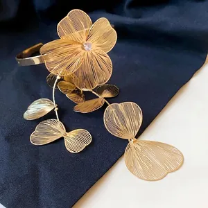 Elegant gold filigree flower open bangle with zircon and tassel leaves