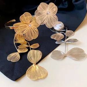 Elegant gold and silver flower zircon tassel armlet with detailed hollow mesh design
