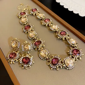 Vintage necklace set with square crystals in antiqued gold-tone, elegant detail shot