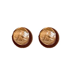 Elegant retro round earrings featuring gold woven texture and dark brown flocked base design