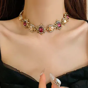 Elegant vintage palace style choker necklace featuring purple and champagne crystals on model