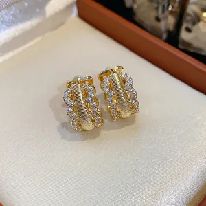 Detailed view of 18K gold plated hoop earrings with shimmering pavé set cubic zirconia