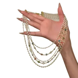 Vintage multi-layer pearl necklace with colorful gemstones for a royal palace look