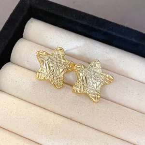 Elegant gold star stud earrings with unique textured wrinkled surface for women