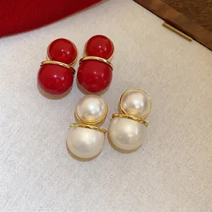 Vintage double sphere stud earrings in vibrant red and cream pearl with gold finish
