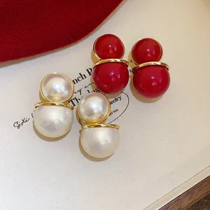 Retro oversized Ankara red and white pearl double sphere stud earrings with gold trim