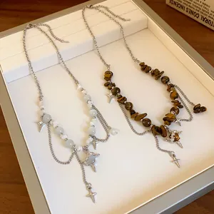 Close-up of irregular tiger's eye and cat's eye star pendant stainless necklaces