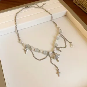 Vintage stainless steel necklace featuring cat eye stones and celestial star pendants