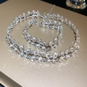 Close-up of elegant double-layer rhinestone necklace and bracelet set in silver finish