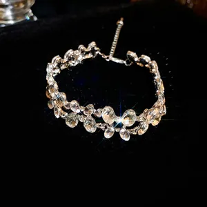 Detailed macro view of a double-layer silver choker with irregular oval rhinestones