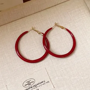 Vintage Ankara red drip oil hoop earrings with elegant golden silver needles for women.