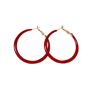 Classic retro Ankura red enamel hoop earrings with gold posts on white background
