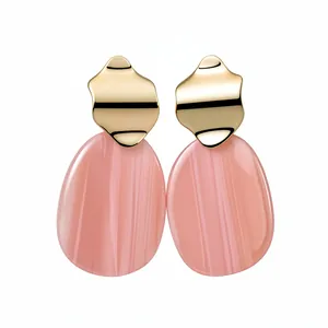 Elegant pink acrylic irregular oval earrings with gold-finished wavy metallic studs