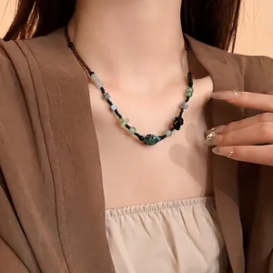 Elegant New Chinese style beaded necklace with turquoise and silver floral charms on model