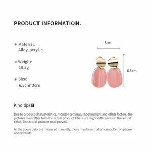 Detail view of pink acrylic irregular oval earrings with size and material specifications