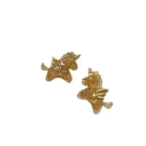 Elegant gold plated unicorn stud earrings with sparkling cubic zirconia and wing details