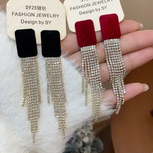 Detail of square flocked earrings with sparkling long rhinestone tassels and S925 needles.