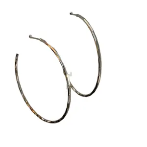 Minimalist silver hoop earrings with textured hammered finish, circular fashion jewelry.