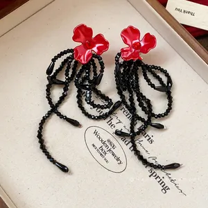 Elegant red flower earrings with long black beaded tassels and silver needles for women