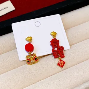 Festive red Chinese New Year earrings with golden lion dance and wealth character charms