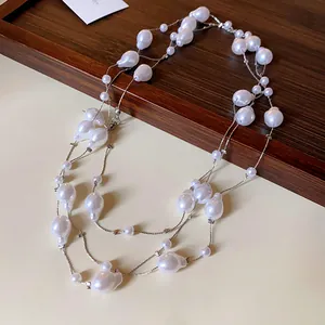 Elegant multi-layer necklace with baroque-style artificial pearls on a fine silver chain