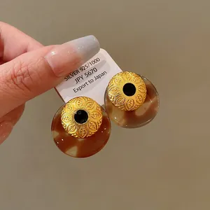 Vintage Maillard style tortoiseshell resin earrings with gold textured metal centers