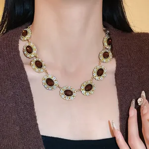 Vintage palace style necklace featuring oval brown gemstones with floral accents